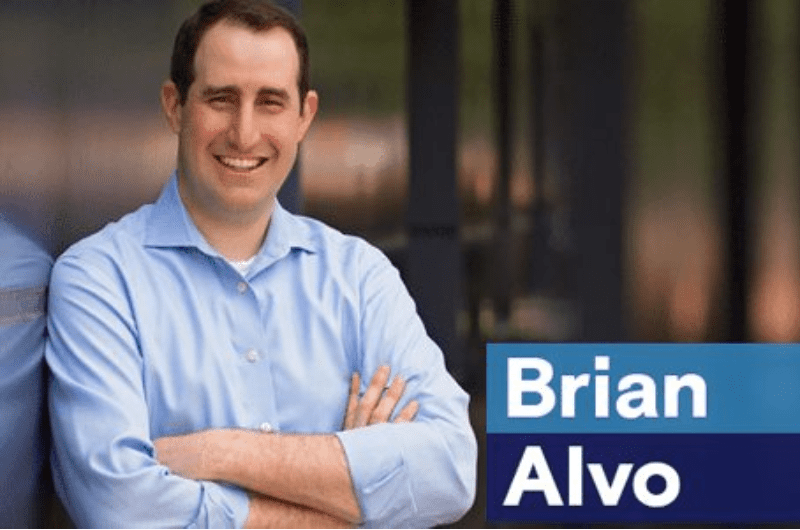 Brian-Alvo-feature-img brian alvo a man with his arms crossed