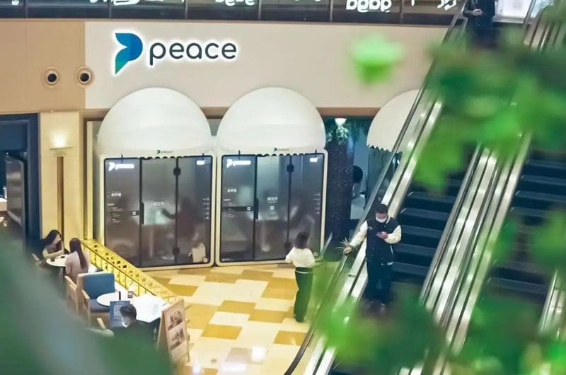Peaces-on-demand-work-pods-in-Shanghai a shopping mall with escalators and people