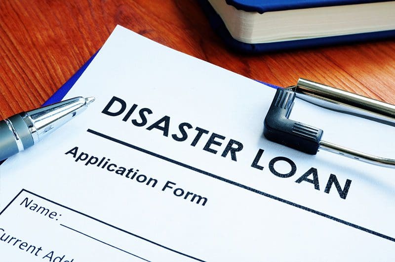 sba-waives-disaster-loan-interest-and-payments-for-first-year disaster loan application on a desk