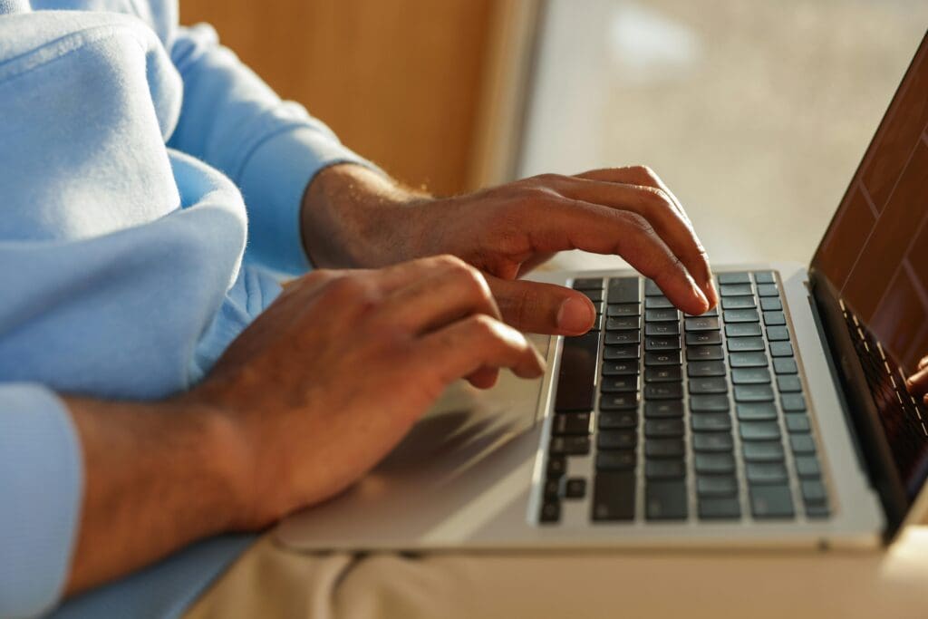 A person working on the laptop.